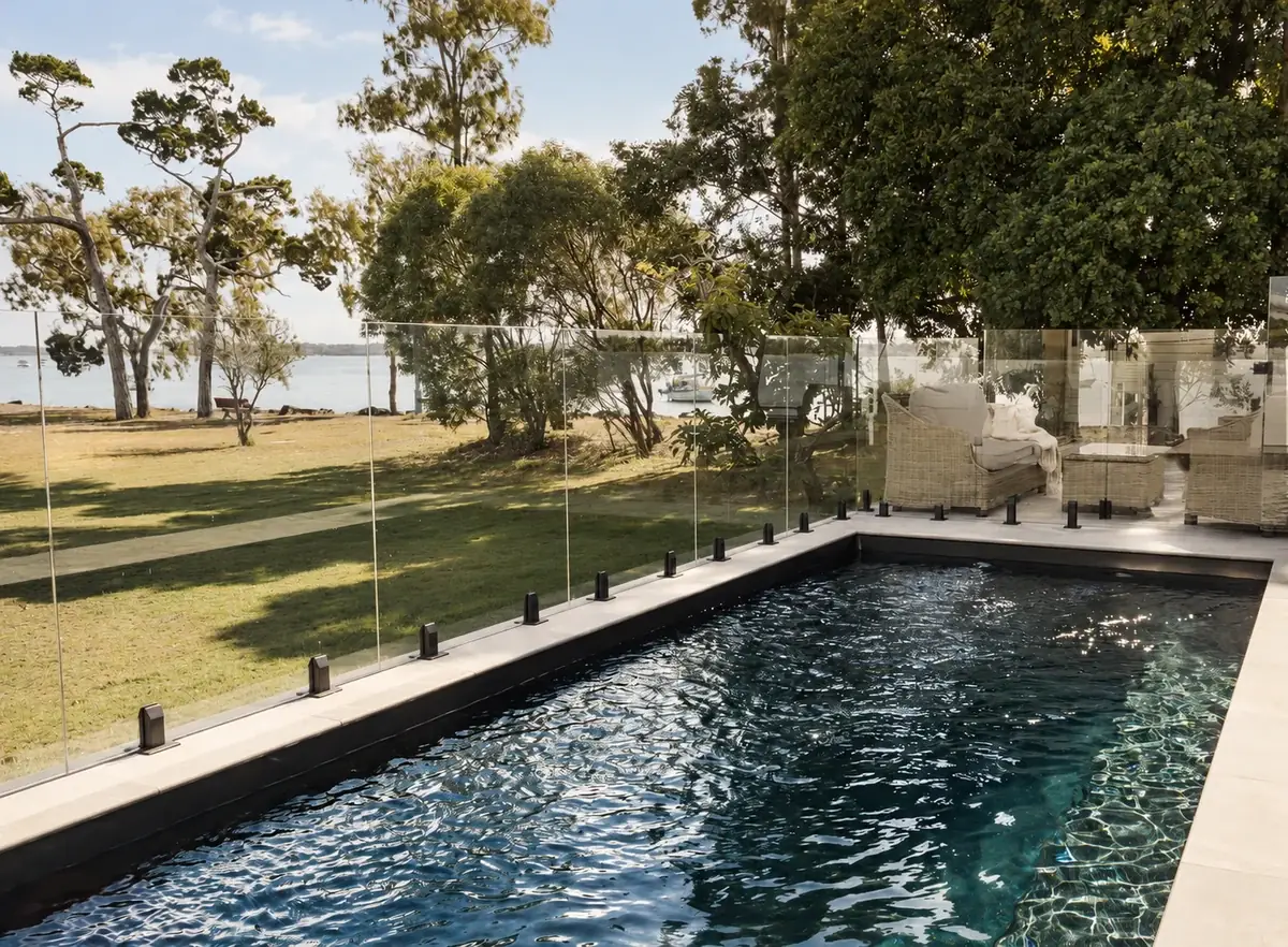 Sunset Waters heated pool beside its garden overlooking the Burrum River